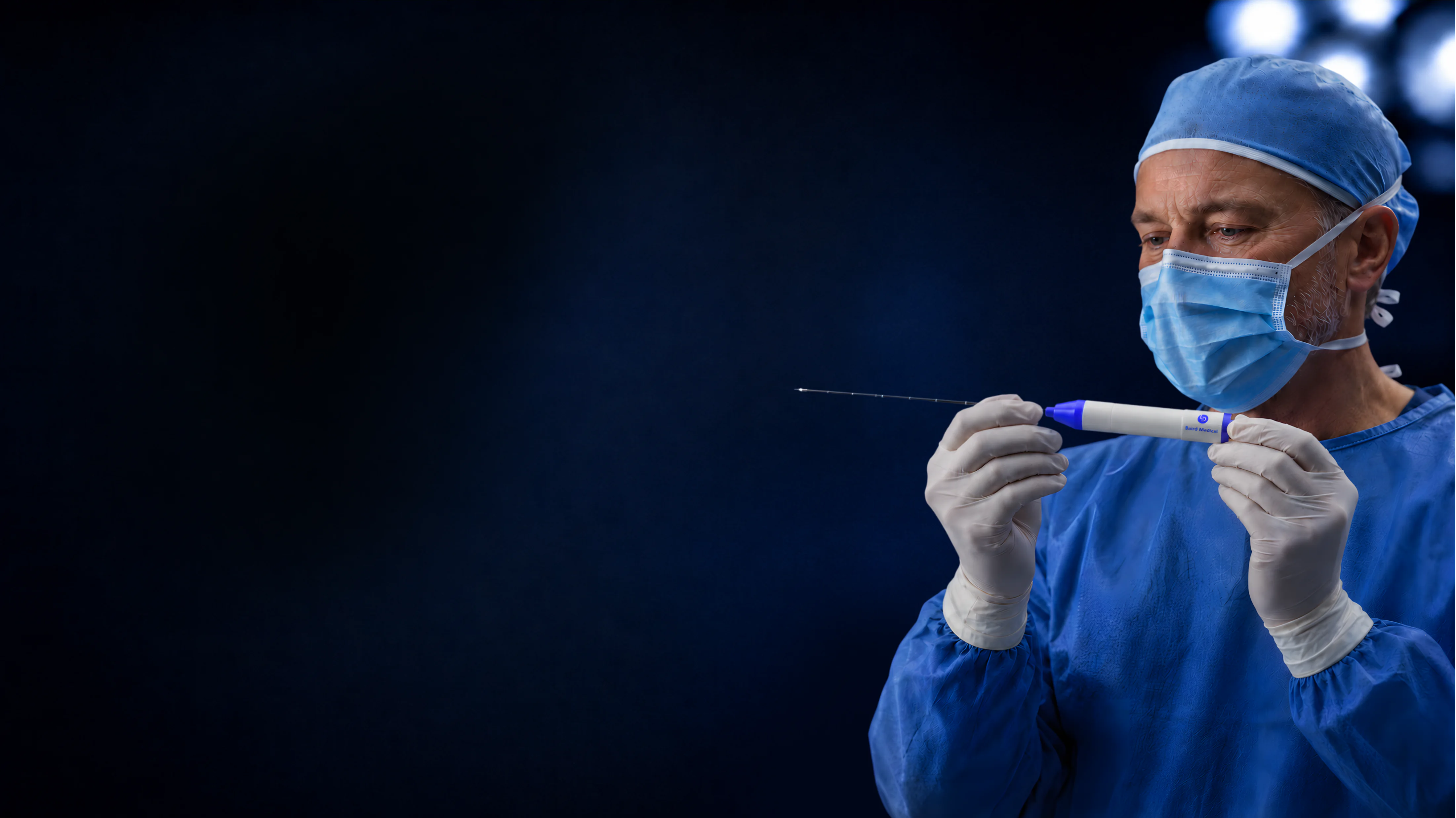 Physician holding the Baird MWA needle